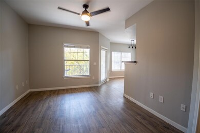 Unfurnished room featuring dark wood-type floorin