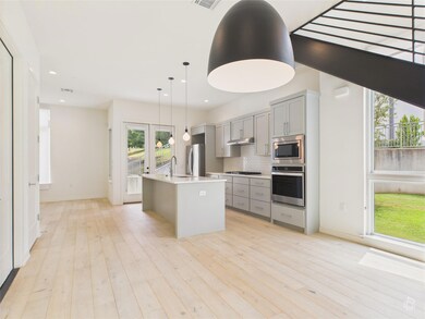 Kitchen featuring appliances with stainless steel
