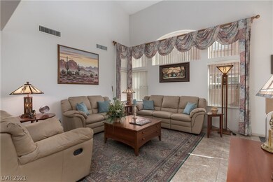 Grand entrance with volume ceilings.  Warm light a