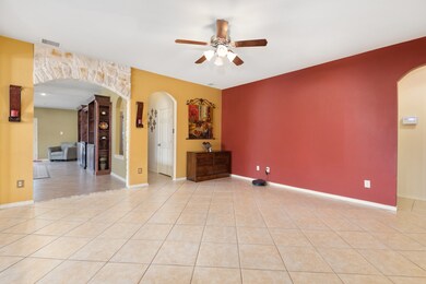 This huge open space can be used as a living room, dining room or whatever you choose! the door way to the right leads to the half bath and the laundry room to the left and the garage door to the right!