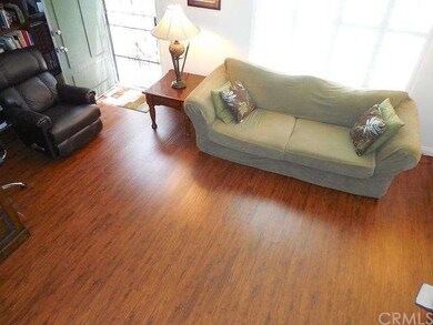 Living Room with New Wood Laminate Flooring and Pl