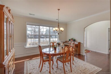 Formal dining room connects to kitchen via butler'