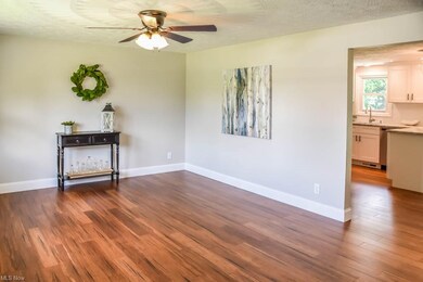 The living room boasts gorgeous bamboo flooring.