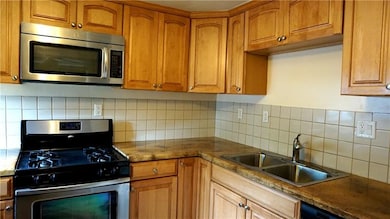 Fresh stainless steel appliances, crisp cupboards,