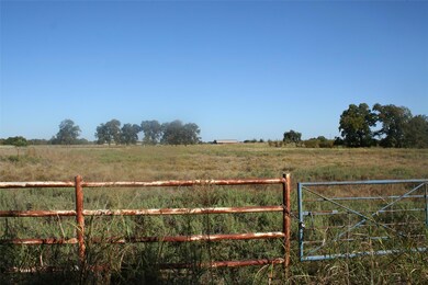 View of yard with a rural view