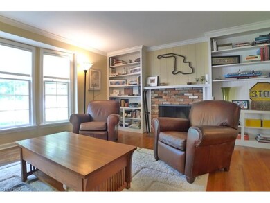 The light-filled living room with ceiling molding 