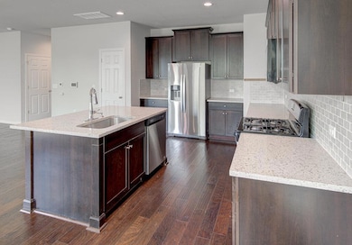 Kitchen featuring stainless steel appliances, a s