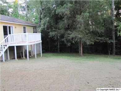 Enjoy the spacious back yard from the deck just outside the kitchen.