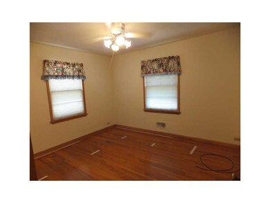 Bedroom. The exposed hardwood in the bedroom can a