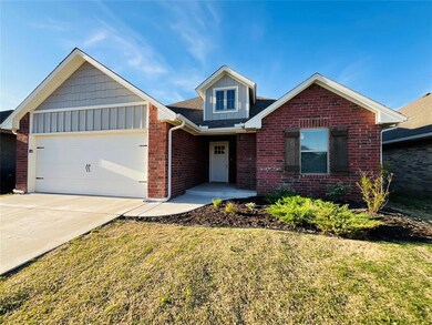 View of front of property with a garage and a fron
