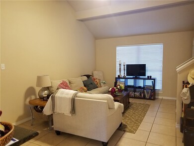 Living room featuring lofted ceiling and lots of n
