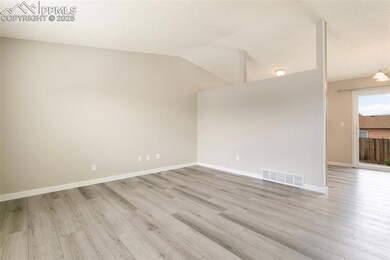 Empty room featuring light wood-type flooring, vau