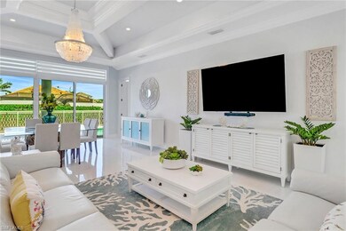 Living area with a chandelier, crown molding, rece