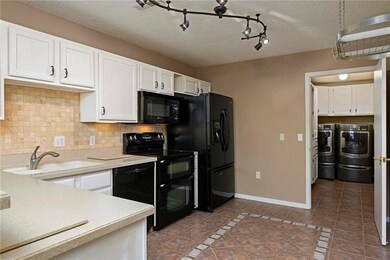 Kitchen, and looking into laundry room