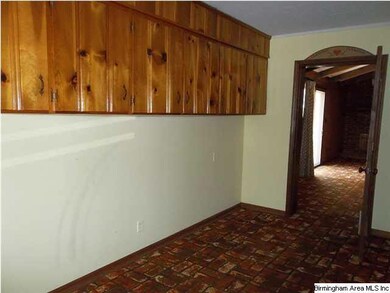 Storage area just off of carport and outside entra