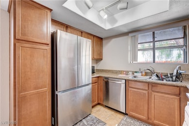 Kitchen with appliances with stainless steel finis