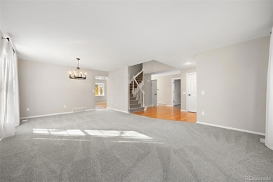 Living/dinging room with new carpet, paint & light fixtures