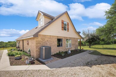 Sidewalks & flowerbeds surround the entire home.