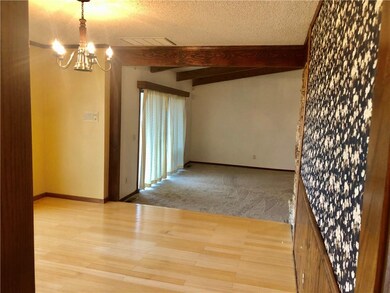 Dining room between kitchen to living room with ba