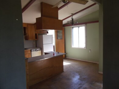 Kitchen is open to nook and living room.