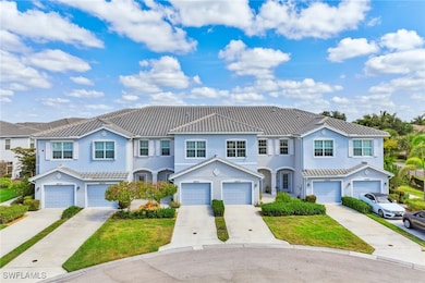 Multi unit property featuring driveway, stucco sid