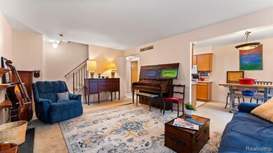 Living room featuring light carpet