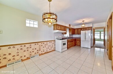 Eating area has plenty of room for formal dining room furniture