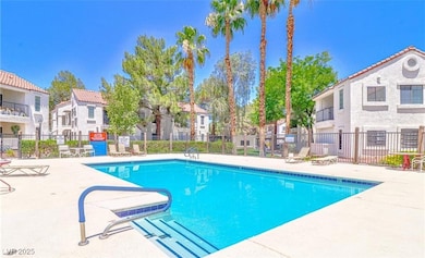 Community pool featuring a residential view, a pat