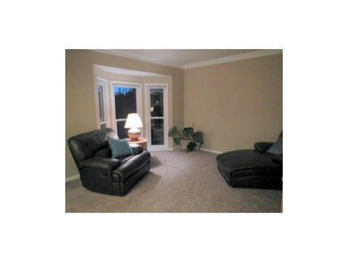 Formal living room with bayed window office also h