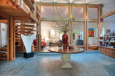 The Spacious ATRIUM is an incredible WOW factor in this lovely and unique home.