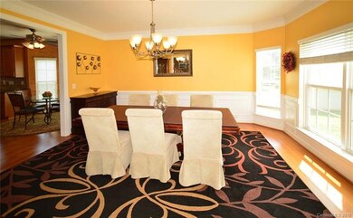 Lovely Dining Room with crown/chair rail & picture