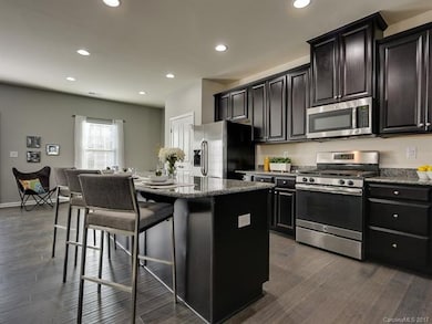 Oversized granite topped island. Stainless Gas sto