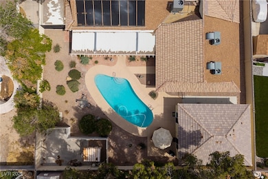 View from above of property featuring a pool area