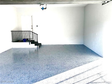 Two-car garage under the den is steps from the pri