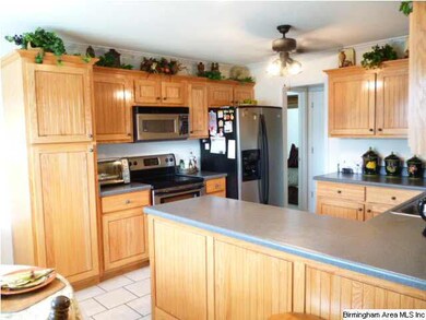 Lots of cabinets, stainless appliances, pantry and