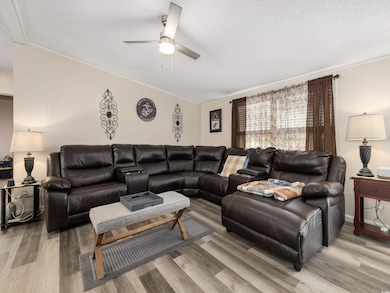 Living room featuring a textured ceiling, ceiling 