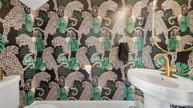 Well-appointed half bathroom ideal for family, friends, and guests.