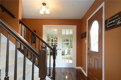 The warm inviting entry offers beautiful laminate 