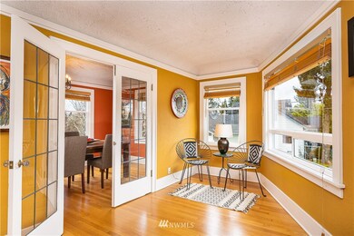 Adorable sitting area of the 2nd floor residence.  Was a perfect place for a grand piano...French doors lead to dining room or possibly a 3rd bedroom!