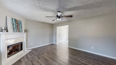 Lots of natural light and pretty vinyle floors with gas fireplace