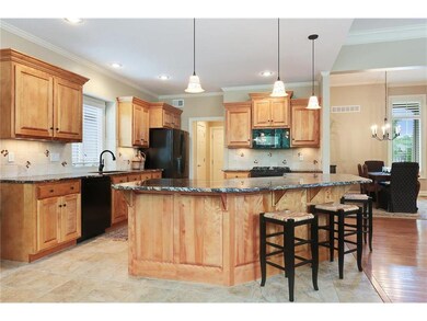 The kitchen island is very large with ample space 