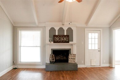 Living room with window on one side and back door 