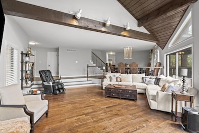 Living room with vaulted wood ceiling