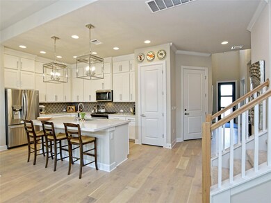 Kitchen featuring stainless steel appliances, tas
