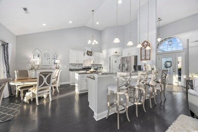 Kitchen with a high ceiling, tasteful backsplash, 