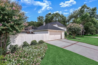 Inlaid brick at the double-wide driveway adds additional interest to what would otherwise be just a plain, concrete pad.