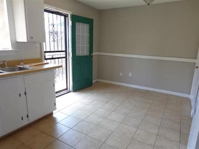 Kitchen with healthy amount of natural light, a si