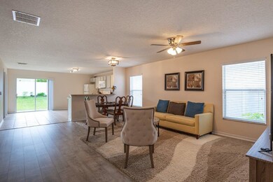 Open Living & Dining Room flowing into Kitchen