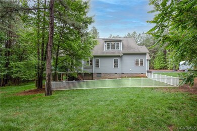 Back of property featuring a yard