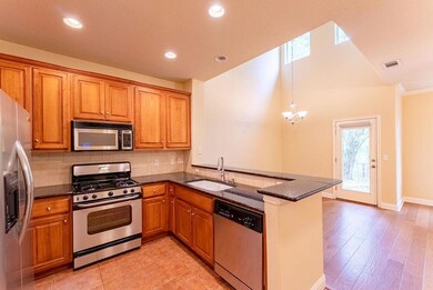 Kitchen with stainless steel appliances, visible 